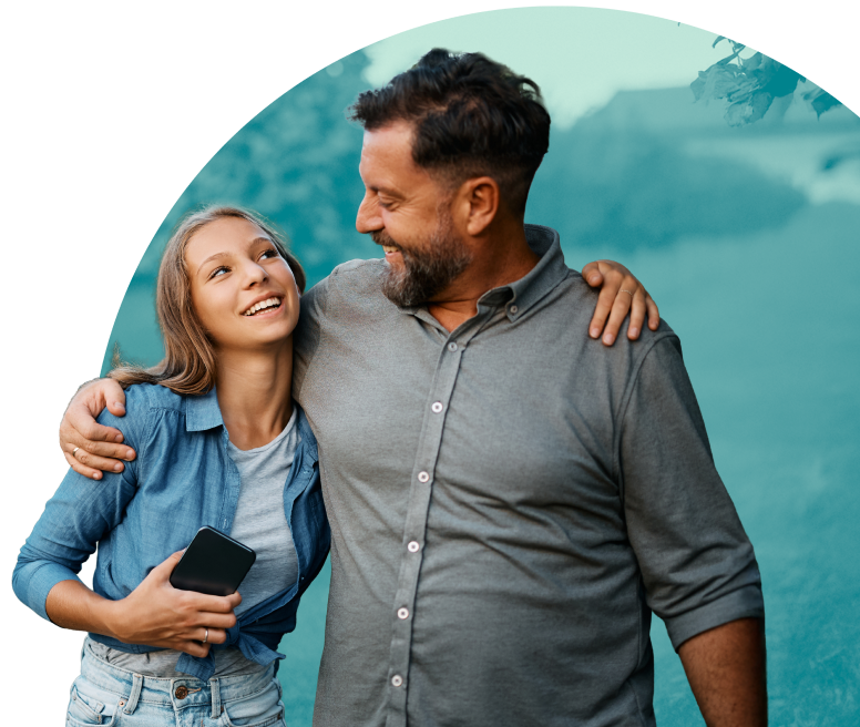Parent and teen smiling together